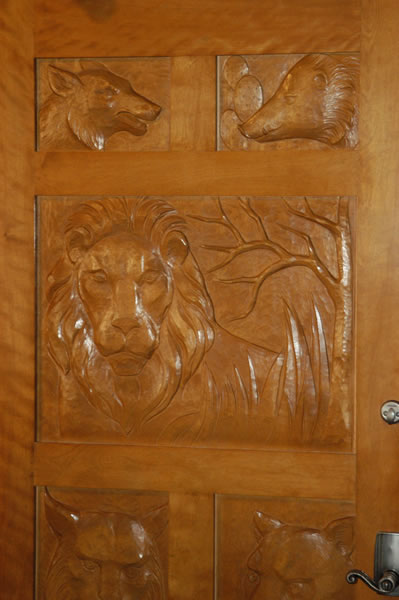 Door with animals carved in it